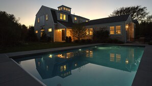 A modern house with a swimming pool at dusk. - Nantucket Art House - In Town ~ Heated Pool ~ Includes Guest House!  (Nantucket)