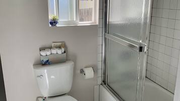 Combined shower/bathtub, hair dryer, towels, soap