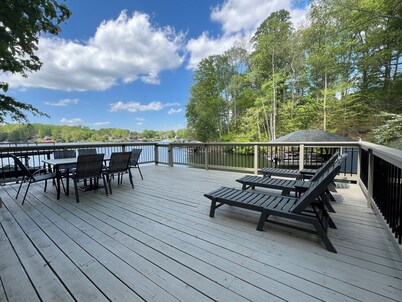 5 Bed 4 Bath Waterfront Home on Deep Water Cove Ideally located by car or boat!