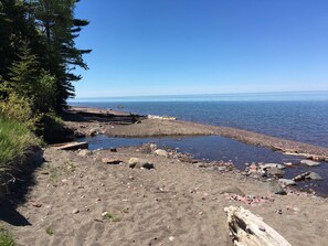 On the beach, sun-loungers, beach towels - NORTHERN LIGHTS!  Stately 5 bedroom beach house on Lake Superior. (Allouez Twp)