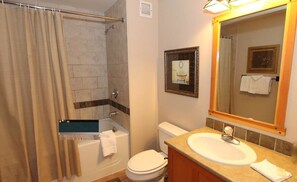 Combined shower/tub, hair dryer, towels, soap