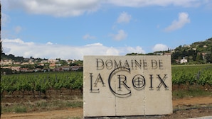 A sign with "Domaine de La Croix" written on it, surrounded by vineyards and a hilly landscape in the background. - Charming Apt On Cote D'azur With Sea Views, Walking Distance To Beach And Shops  (La Croix-Valmer)
