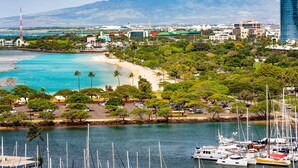 A coastal cityscape with a marina, beach, and mountainous backdrop. - Ilikai Hotel, Ocean Front, Hip Real 1 BDR,  City View, Best Surf in Waikiki (Honolulu)