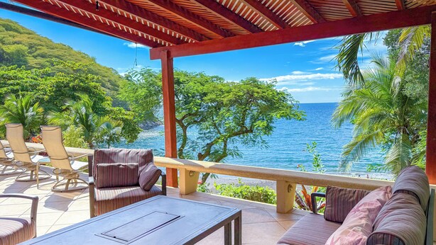A covered outdoor seating area with a view of the ocean. - Villa Cala N°11 - 23 Steps to the Pacific Ocean, Luxury Villa with Stunning View (Bahia Pez Vela)