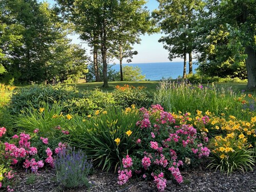 Lake Michigan retreat w/ private beach access, family friendly, solar & gardens