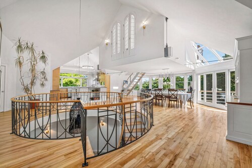 Luxury oceanfront estate with speakeasy, rooftop deck, tennis court & private beach.