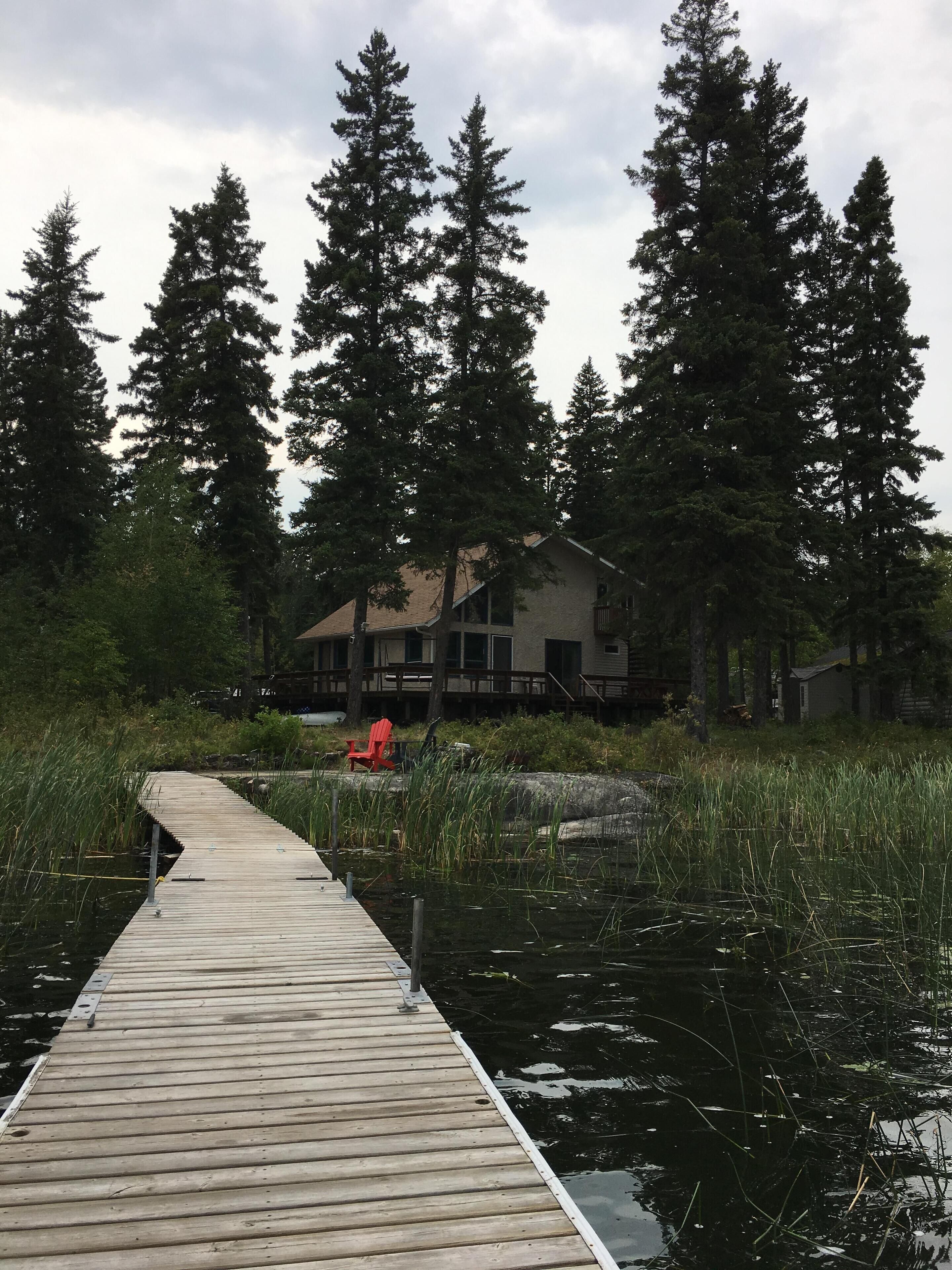 Looking back at the home from the end of the dock during the heat of August.