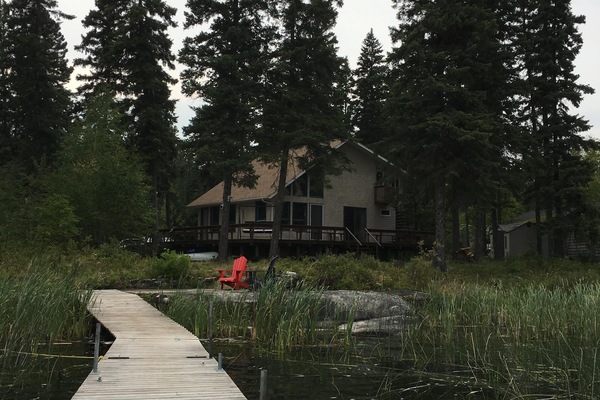 Looking back at the home from the end of the dock during the heat of August.