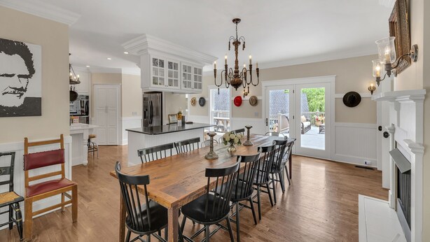 A spacious kitchen with a large island, white cabinetry, and a chandelier. - The Big Blue House - 6000sf of Luxury in Leiper's Fork (Franklin)