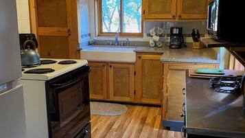 Fridge, microwave, stovetop, coffee/tea maker