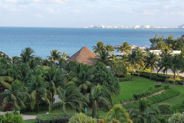 The view from the terrace: the gardens, pool area and beach/ocean