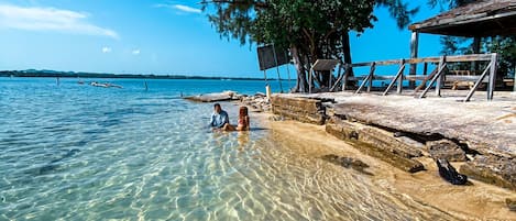 On the beach, sun loungers, beach towels