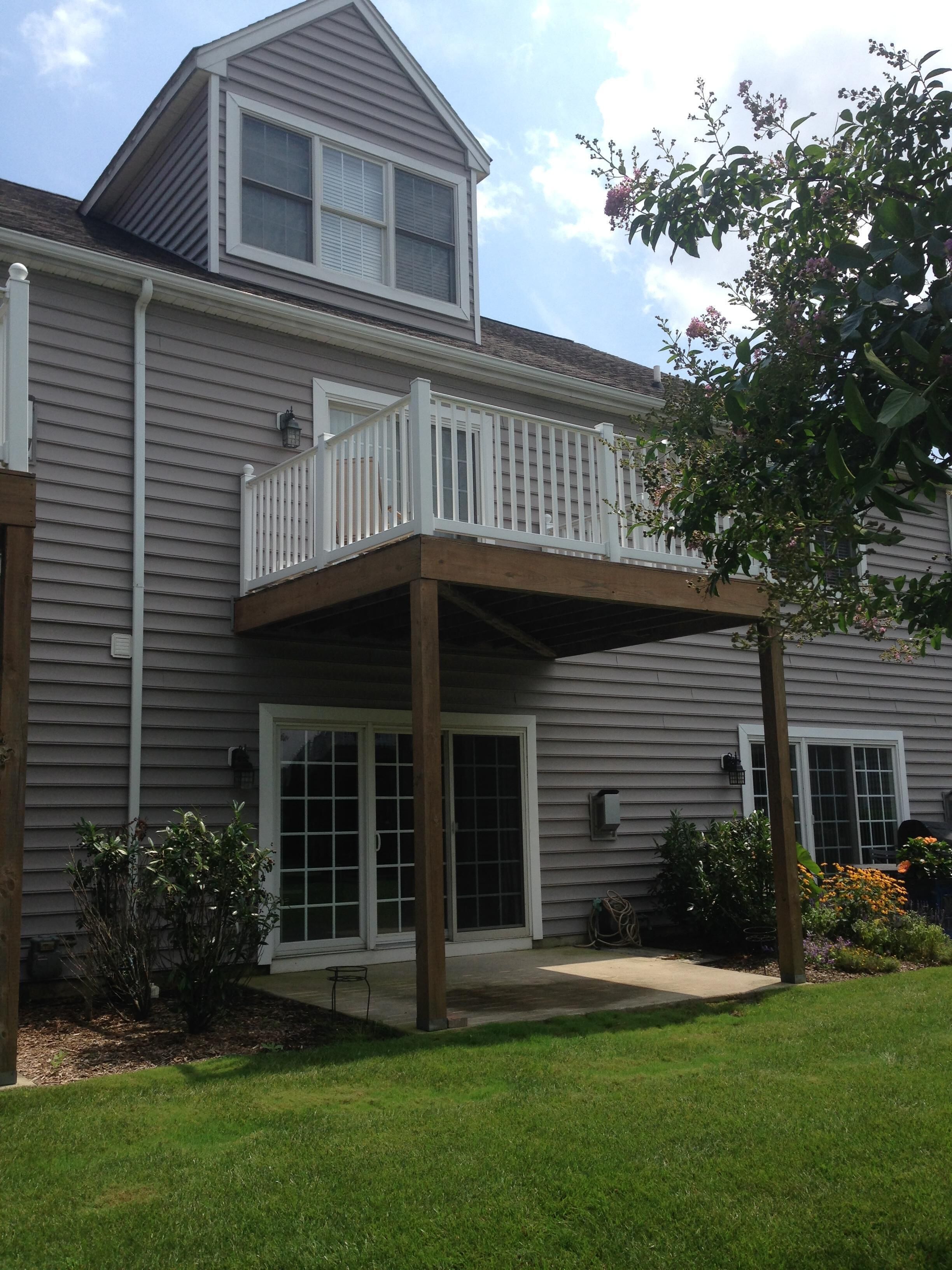 Deck off main bedroom on second floor; patio off living room