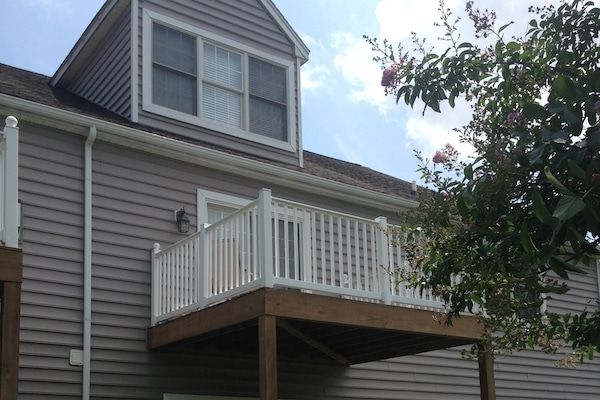 Deck off main bedroom on second floor; patio off living room