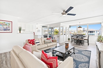 Experience the serenity of our bayfront upstairs retreat overlooking one of Newport Harbor's quiet side channels.
