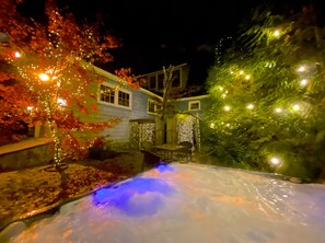 Surrounded by a serene garden with a small water feature, this house offers a peaceful retreat.