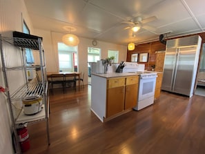 Enjoy cooking in this well-equipped kitchen with a central island, dining area, and modern appliances.