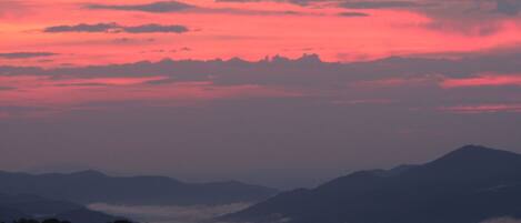 A mountain range with a sunset sky.