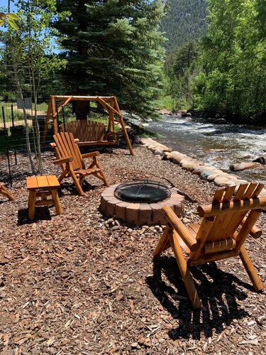 Beautiful river home with large yard, sitting area and fire pit!