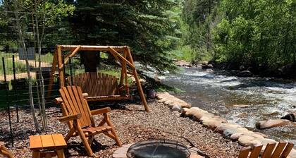 Beautiful river home with large yard, sitting area and fire pit!