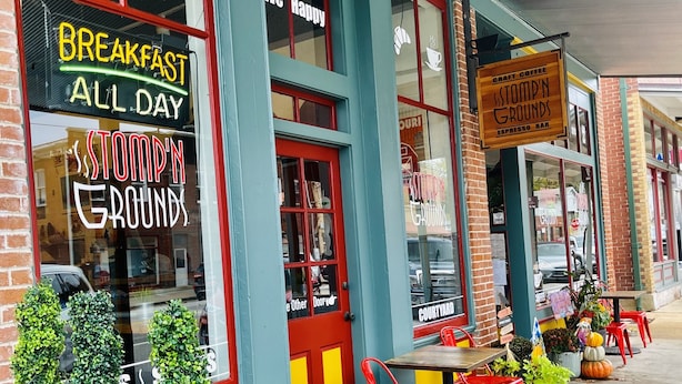 A storefront with a sign reading "Breakfast All Day" and "Stompin' Grounds Espresso Bar". -  SPACIOUS HISTORIC DOWNTOWN LOFT!  BEST LOCATION IN THE HEART OF TOWN! (Hermann)
