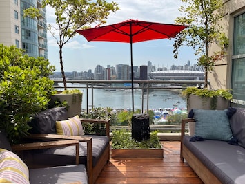 Patio with water feature and gorgeous view of False Creek, and BC Place Stadium.