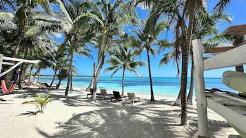 On the beach, sun-loungers, beach towels
