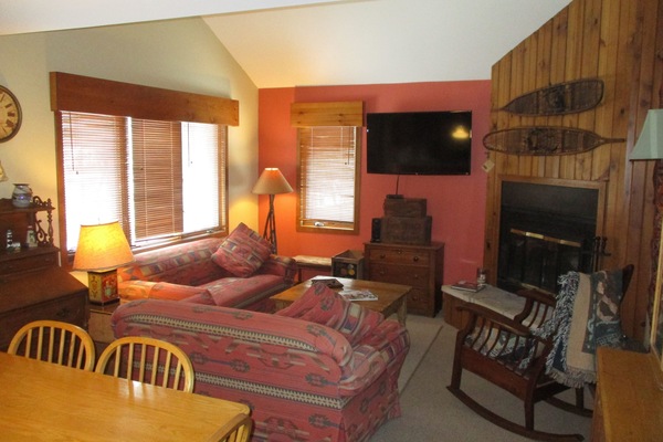 Main upper level living room. HDTV and wood burning fireplace