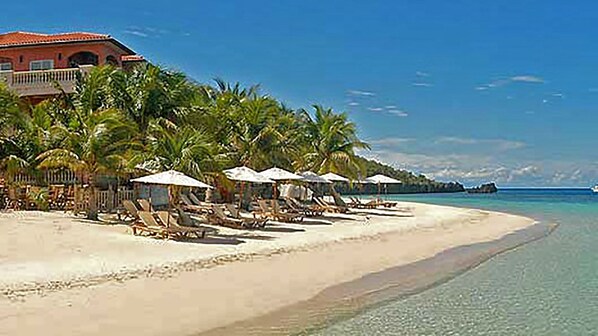 On the beach, sun loungers, beach towels