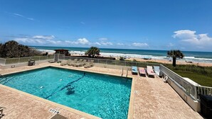 A swimming pool with a view of the beach and ocean. - Large Oceanfront 2BD/2BA, Sleeps 6, Pool, Kitchen, W/D, Parking, Ormond/Daytona (Ormond Beach)