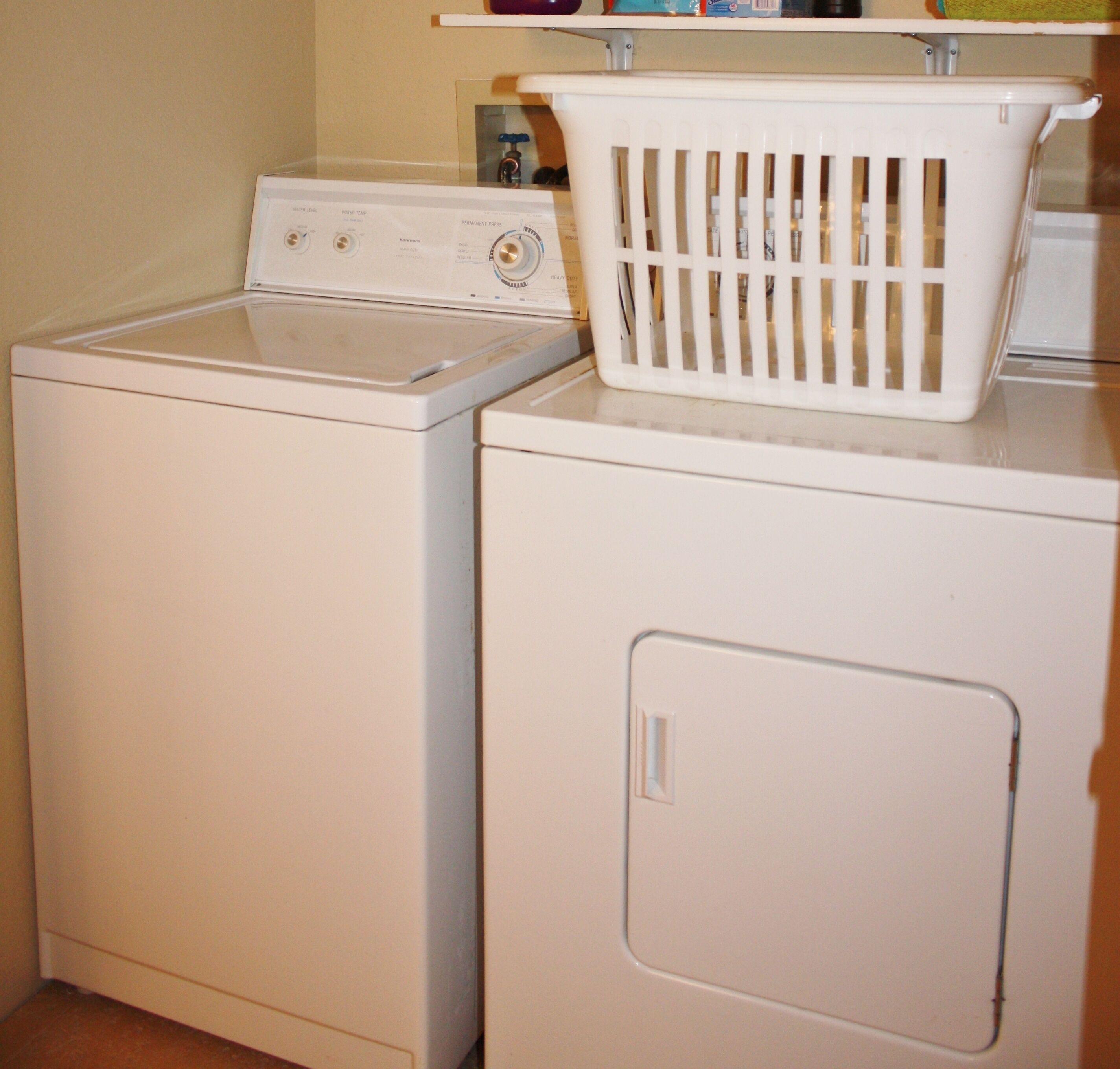 A front-loading washer and dryer stacked together.