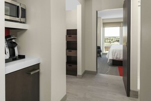 Premium bedding, desk, laptop workspace, blackout drapes