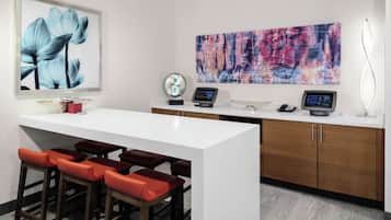 Enjoy cooking in this well-equipped kitchen with a central island, bar stools, and modern appliances.