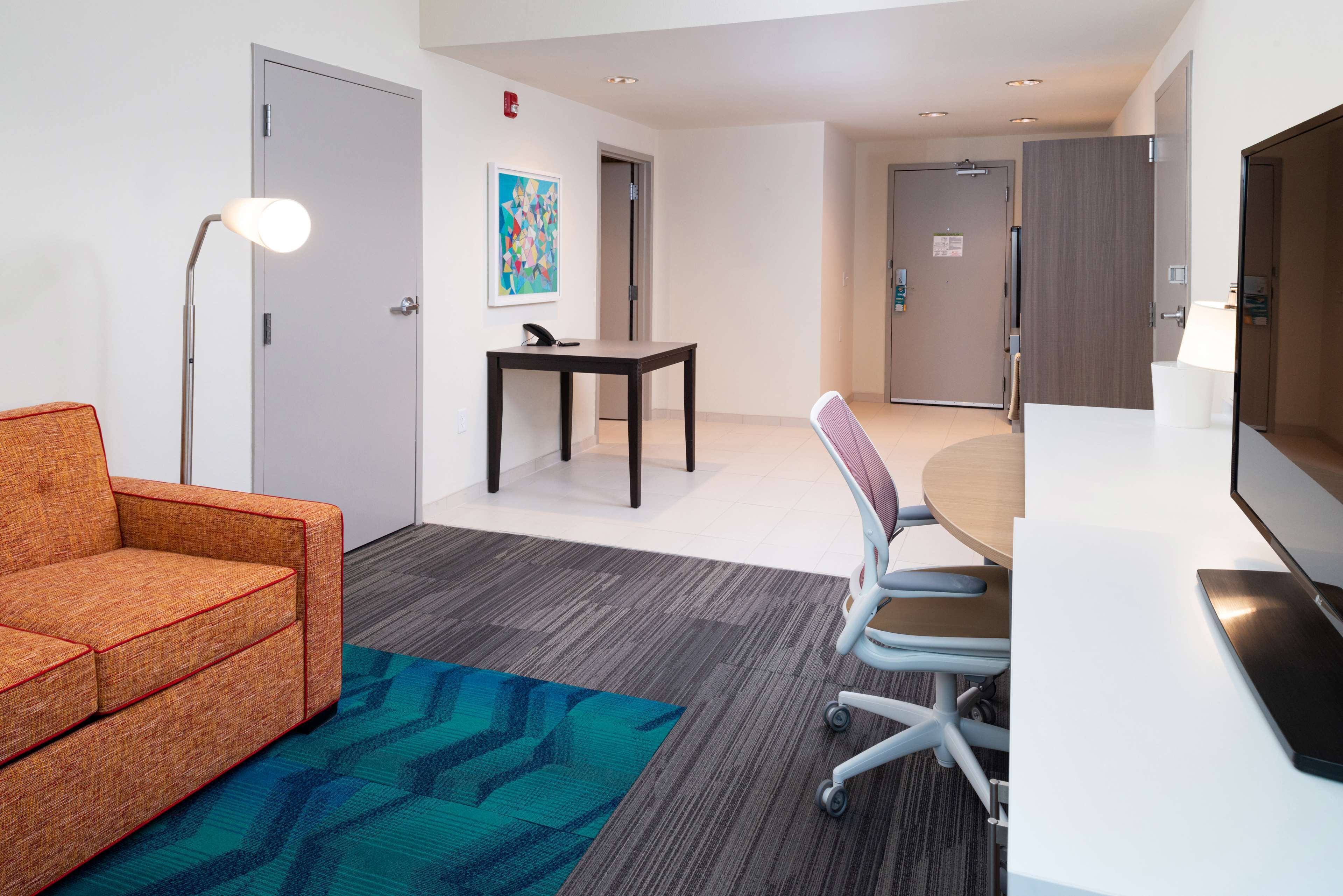 suite, 1 king bed, accessible (roll-in shower) | living area | 42-inch flat-screen tv with cable channels, tv