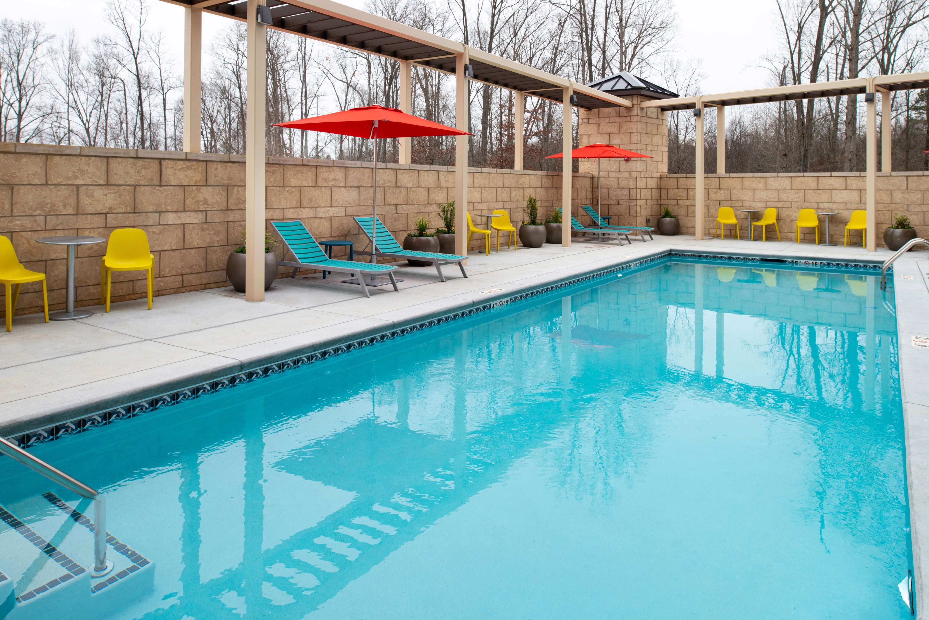 seasonal outdoor pool, open 8:00 am to 10:00 pm, pool umbrellas