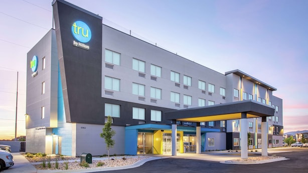 A modern hotel building with a prominent 'tru by Hilton' sign, a covered entrance, and a parking area. - Tru by Hilton Salt Lake City Midvale (Midvale)
