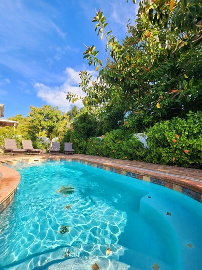 Handicap accessible house one minute from a beach with a heated pool.