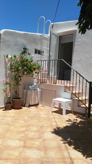 Private sunny terrace surrounded by avocado trees