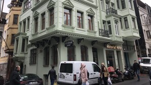 A historical hotel with a classic architectural style, featuring multiple stories, large windows, and ornate balconies. - Historial Hotel (Istanbul)