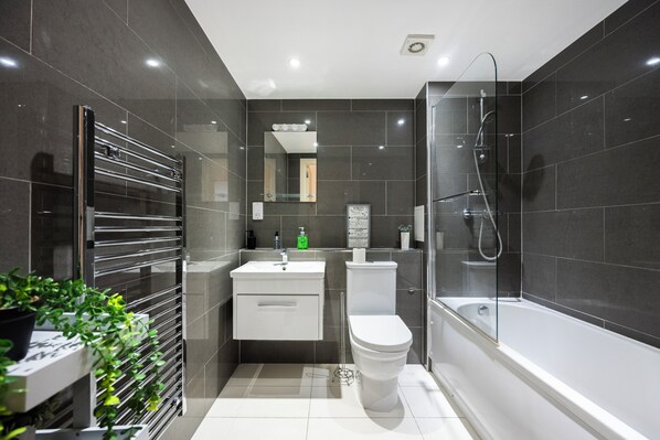 Combined shower/tub, hair dryer, towels, soap