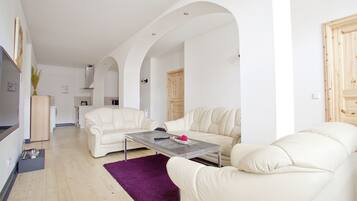 Apartment, 4 Bedrooms (2 people per bedroom) | Living area | Flat-screen TV