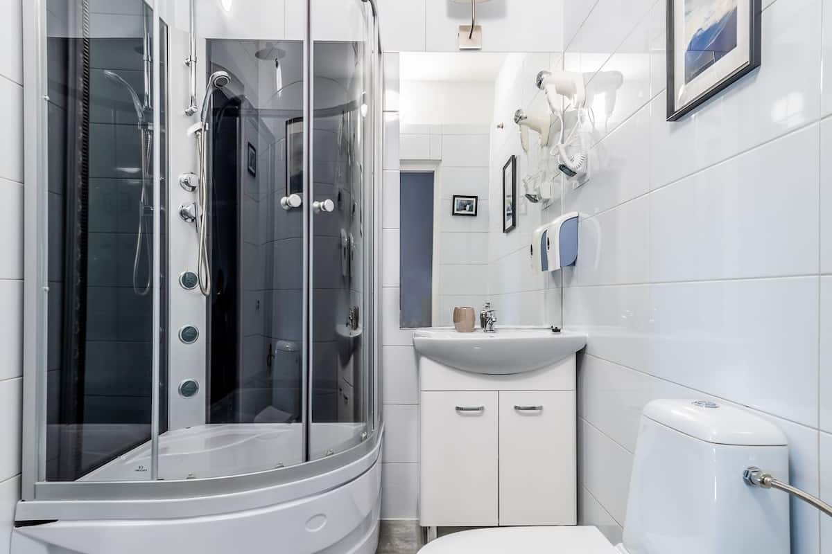 shower, rainfall showerhead, hair dryer, towels