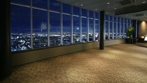 A conference room with large windows offering a nighttime city view. - Hotel Asia - Adults Only (Gifu)
