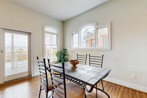 Enjoy meals with family and friends in this cozy dining area, featuring a classic table and chairs.