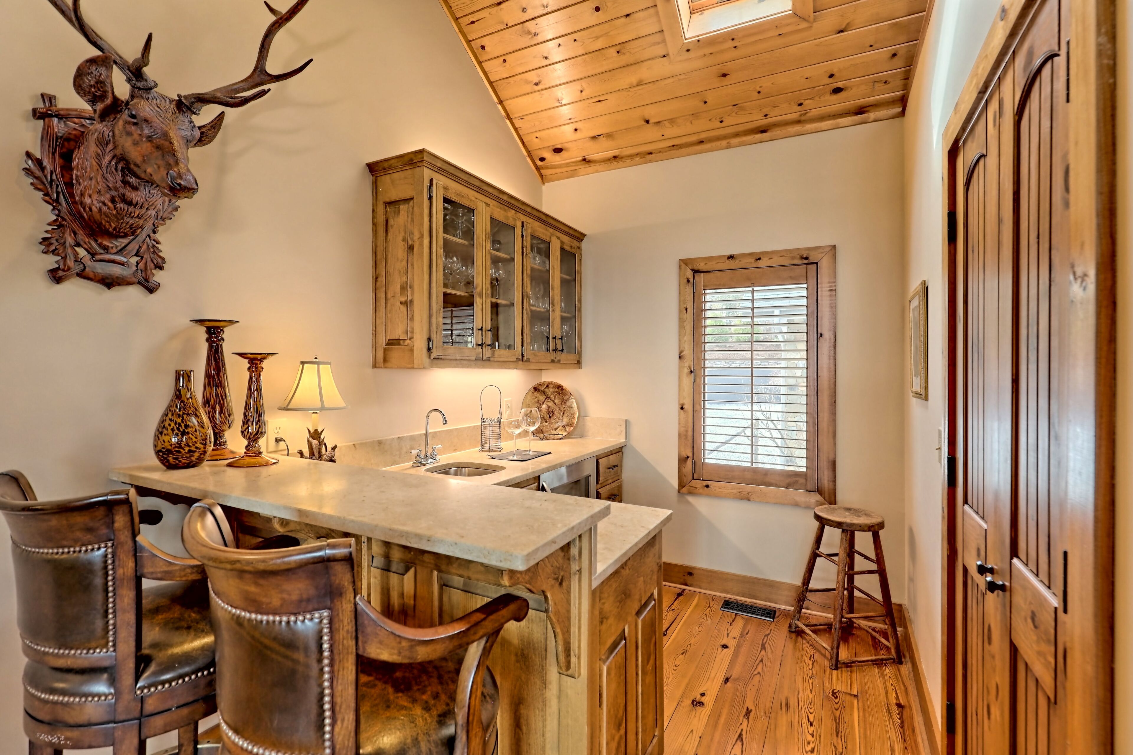 Wet bar off main gathering, wine cooler, ice maker and closet full of games!