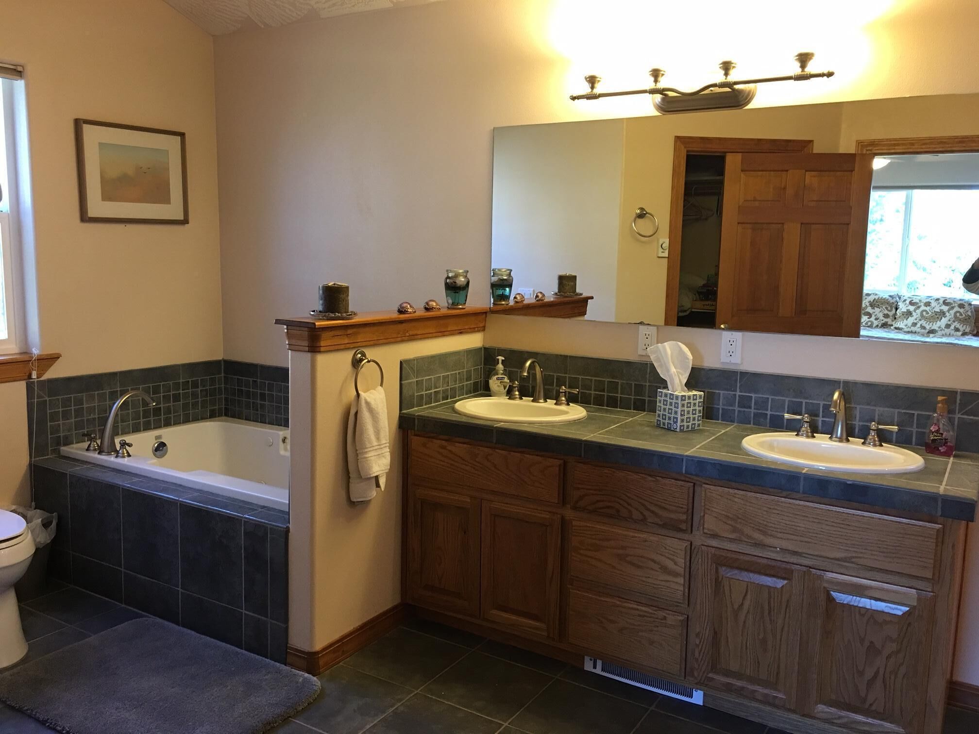 Huge bathroom in the master suite has a jetted tub and a walk-in shower.