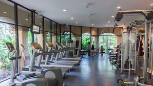 A gym with treadmills, elliptical machines, and weightlifting equipment. - Pools * Hot Tubs * Swim-Up Bar * Spa * Pickleball * Medano Beach! (Cabo San Lucas)