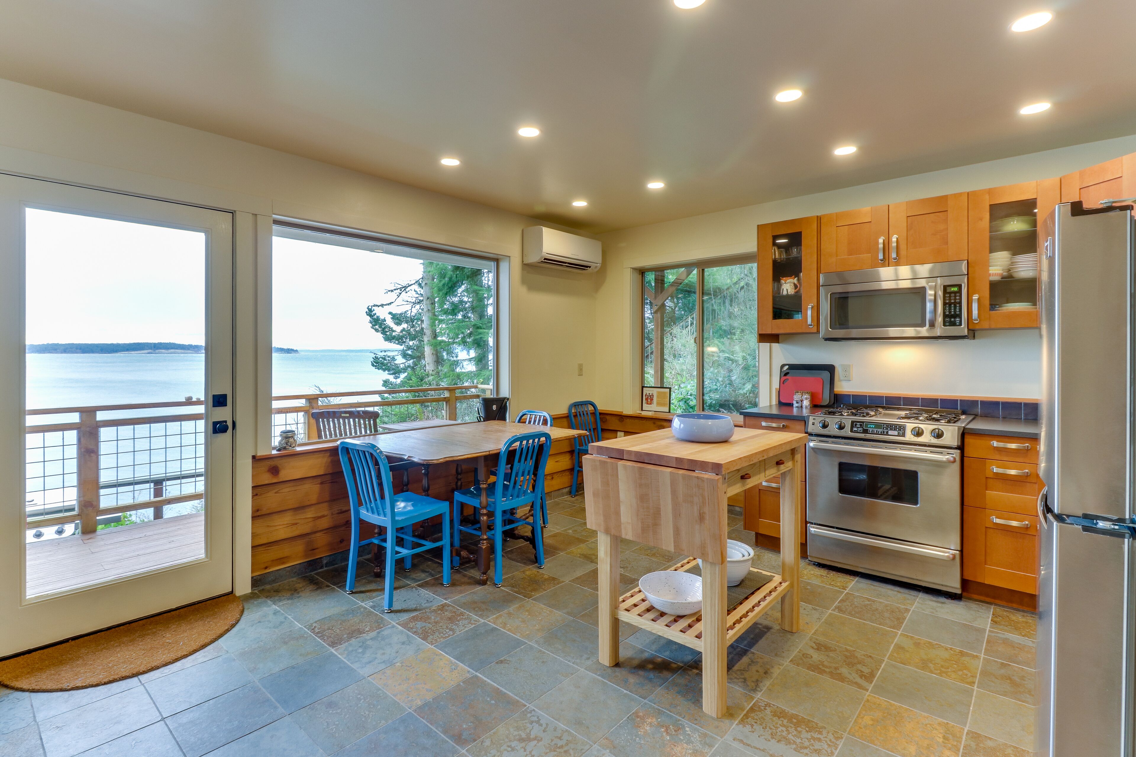 Bayfront home on Oak Bay with fireplace, beachfront, & outdoor dining