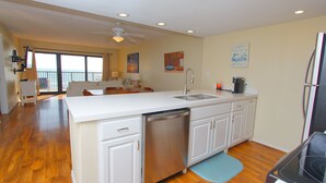 A spacious kitchen with a dishwasher, a sink, and a stove. - Oceanside Zen Escape - Condo 503: 2BR, 2BA retreat in South Padre Island. (South Padre Island)