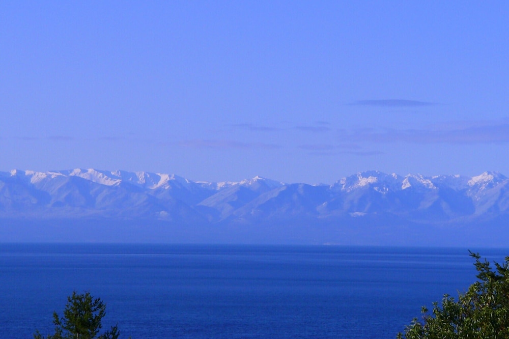 Spectacular West side views of Strait, Olympics, Victoria, south to Mt Rainier.